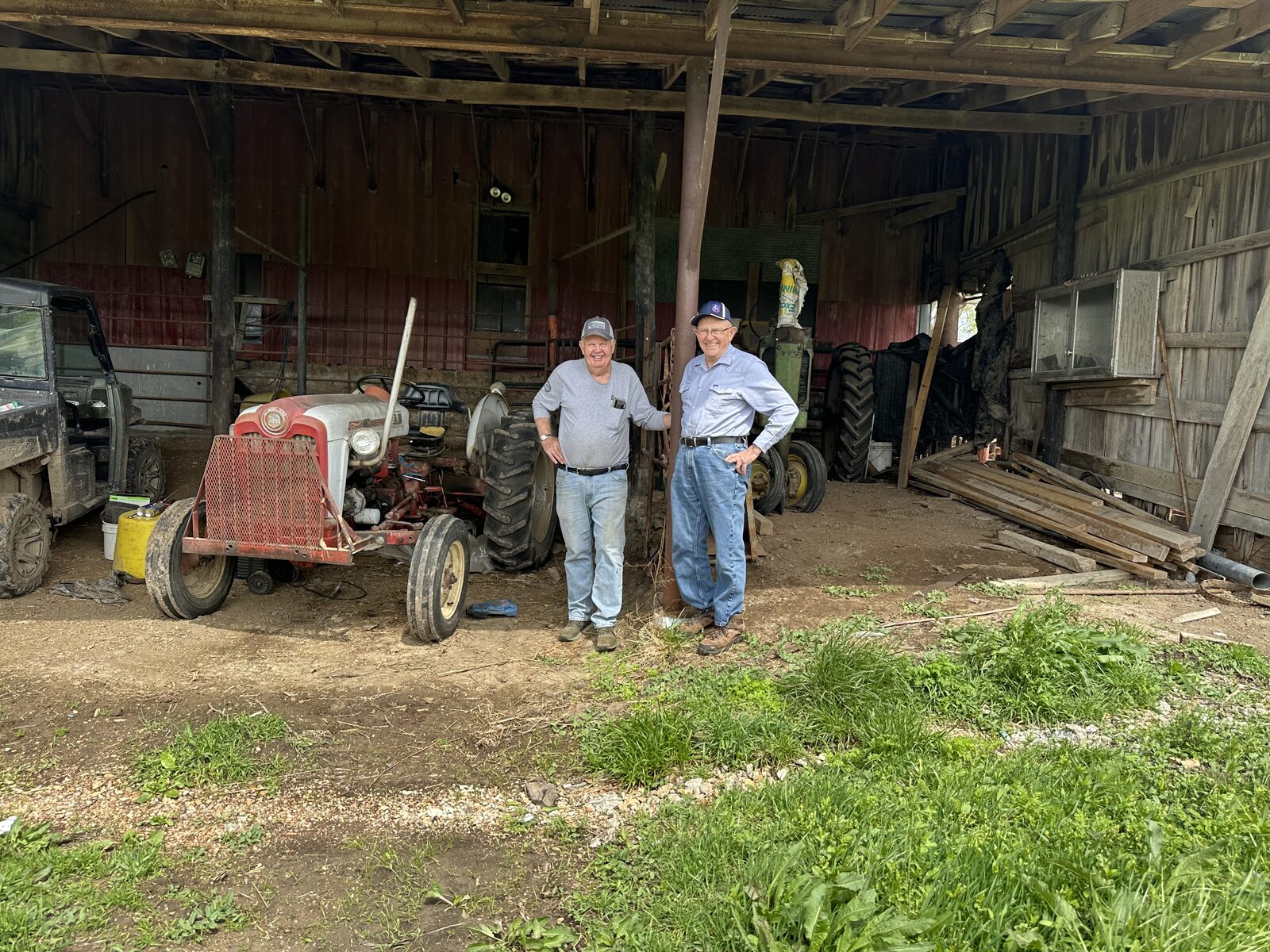 Roger Korenberg with neighbor Art Burger in the barn on Burger&rsquo;s farm in California, Missouri